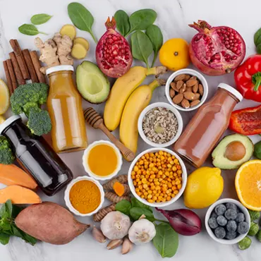 A variety of fruits and vegetables are arranged in a circle
