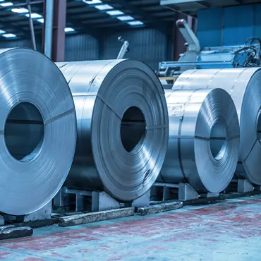 Steel coils stacked in a factory